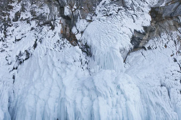 Large Icicles. Lake Baikal. Winter frozen nature