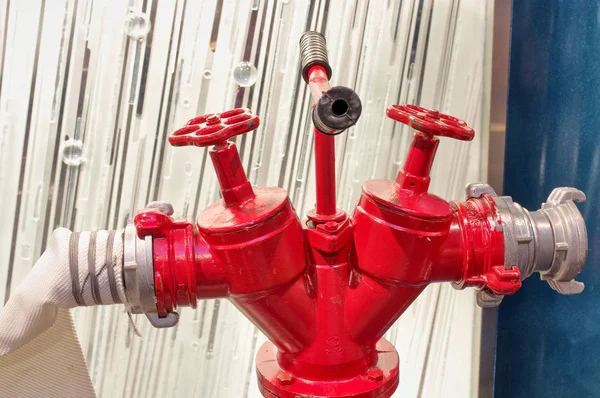 Fire hydrant red with hose connected close-up — Stock Photo, Image