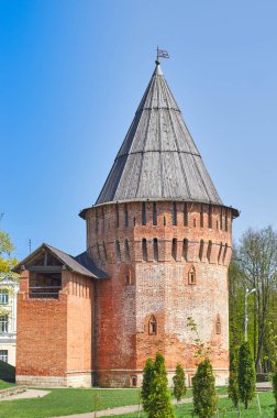 Smolensk fortress wall or Smolensk Kremlin, a defensive structure of red brick with towers and loopholes. Architectural monument clipart