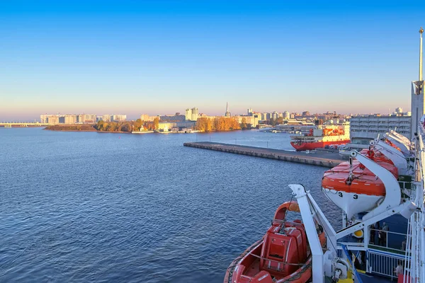 Sea liner moored to the port of St. Petersburg, view from the upper deck to the passenger port railway station