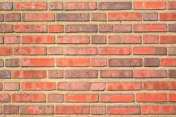 Rött tegel bakgrund med ett tjockt lager av cement, ett fragment av — Stockfoto