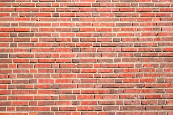 Fundo de tijolo vermelho com uma espessa camada de cimento, um fragmento de — Fotografia de Stock