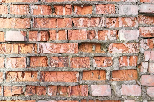 Gammal mur av röd trasiga tegelstenar, bakgrund och textur — Stockfoto