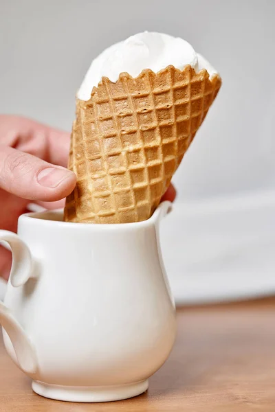 Hand Puts Ice Cream Waffle Cone White Jug Vertical Frame — Stock Photo, Image