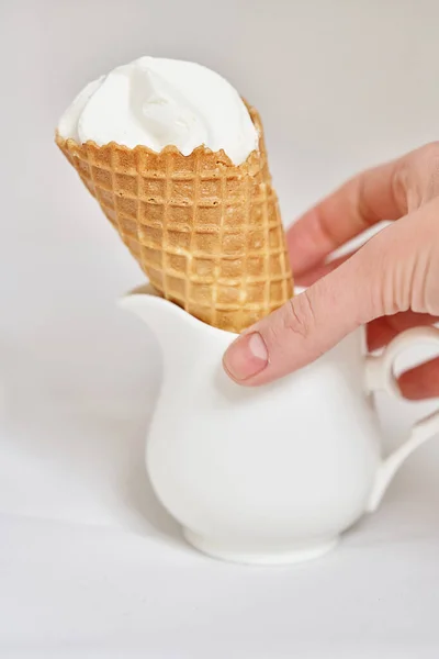 Hand Puts Ice Cream Waffle Cone White Jug Vertical Frame — Stock Photo, Image