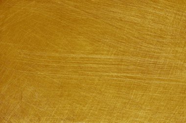 Alüminyum metal arkaplan, altın rengi, parlatılmış paslanmaz çelik üzerindeki çizikler..