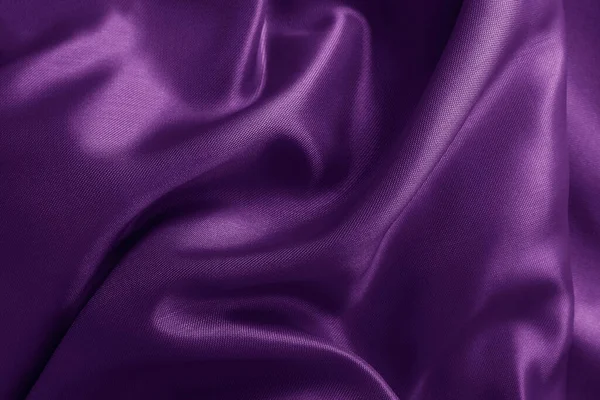 Purple fabric cloth texture for background and design art work, beautiful crumpled pattern of silk or linen.