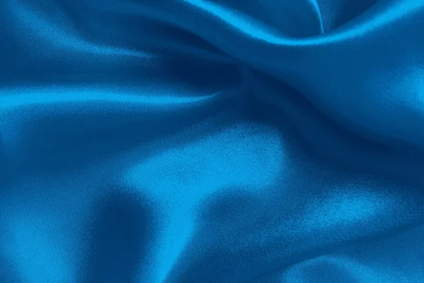Arka plan ve tasarım için mavi kumaş dokusu, güzel buruşuk ipek ya da keten deseni.