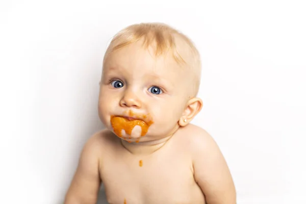 An Adorable baby girl making a mess while feeding herself — Stock Photo, Image