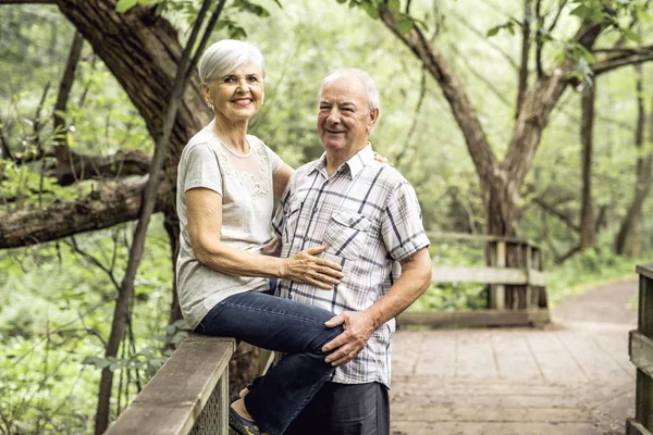 Happy old elderly caucasian couple in a park — Stock Photo, Image