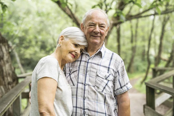 Happy old elderly caucasian couple in a park — Stock Photo, Image