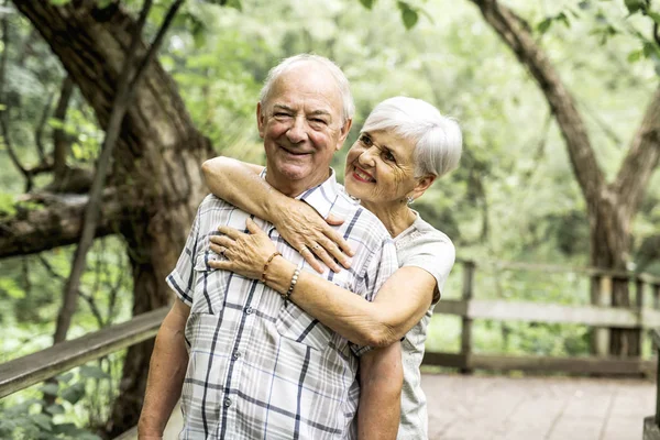 Happy old elderly caucasian couple in a park — Stock Photo, Image