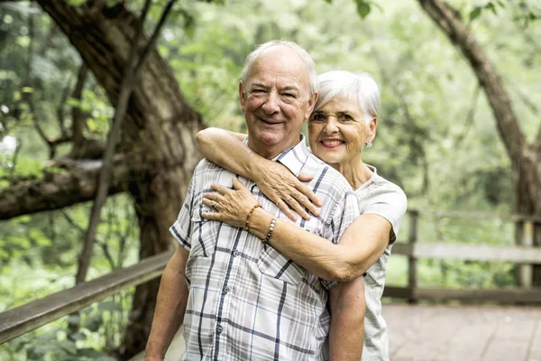 Happy old elderly caucasian couple in a park — Stock Photo, Image