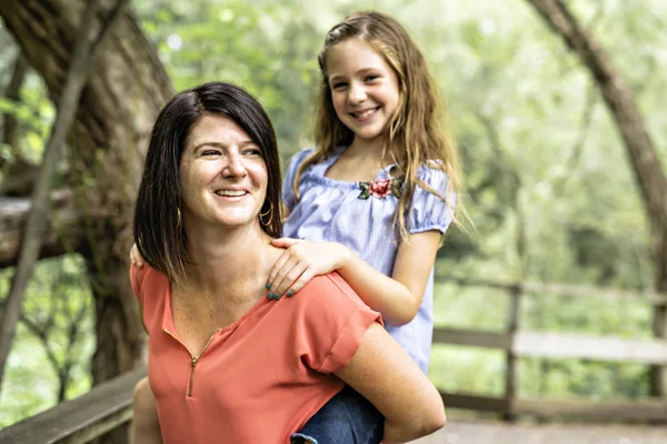 Mother and her daughter on summer forest — Stock Photo, Image