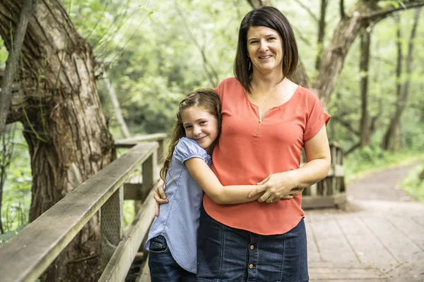 Mother and her daughter on summer forest — Stock Photo, Image