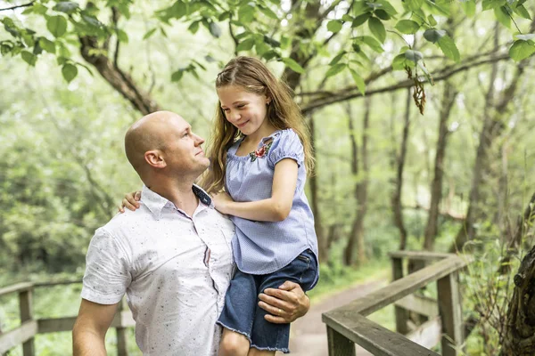 Father having fun in forest with his daughter — Stock Photo, Image