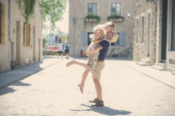 Outdoor lifestyle portrait of young couple in love in old town — Stock Photo, Image