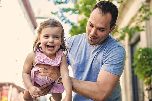 Young father on street with tiny daughter girl — Stock Photo, Image