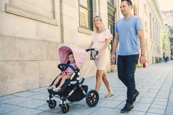 stock image Family taking a walk down the street