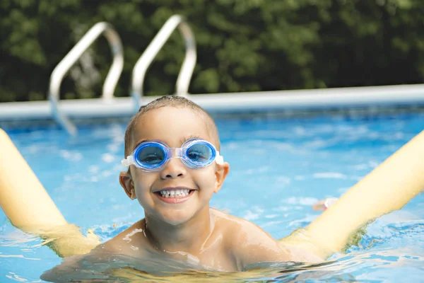 Portrait of boy having good time in swimming pool — Stock Photo, Image