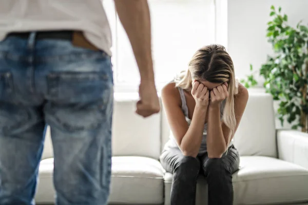 Man beating up his wife illustrating domestic violence — Stock Photo, Image