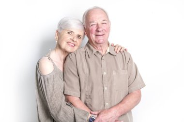 Senior couple posing on studio white background clipart