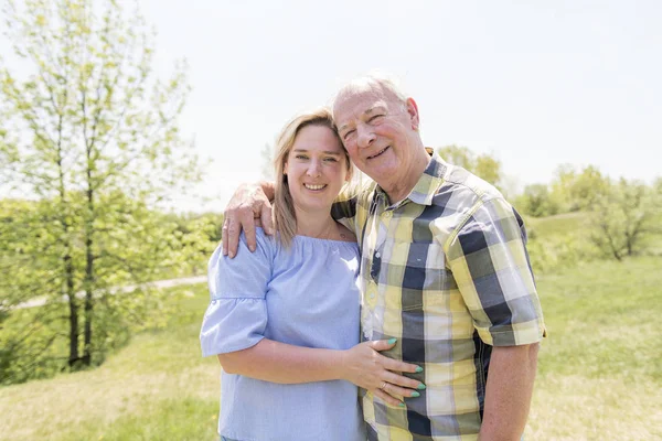 Portrait Of A Smiling Young Woman With Her senior Father — Stock Photo, Image