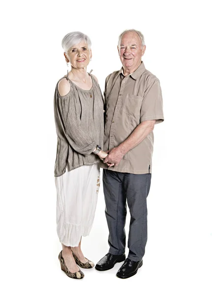 Senior couple posing on studio white background — Stock Photo, Image