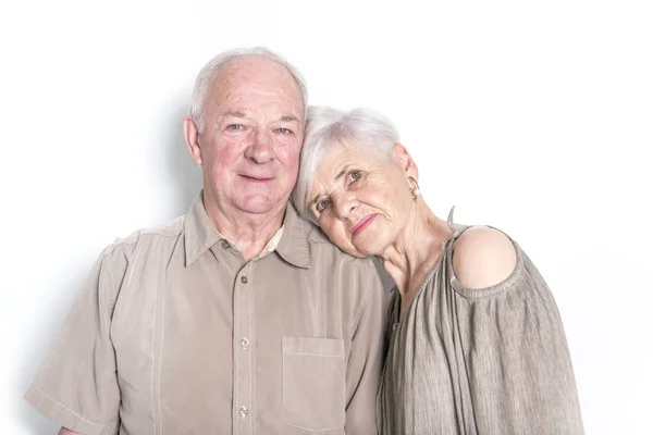 Senior couple posing on studio white background — Stock Photo, Image