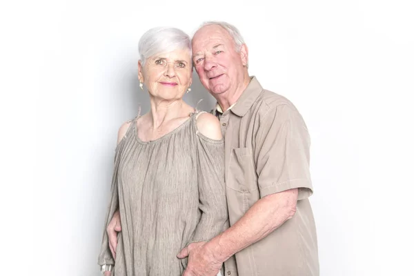 Senior couple posing on studio white background — Stock Photo, Image