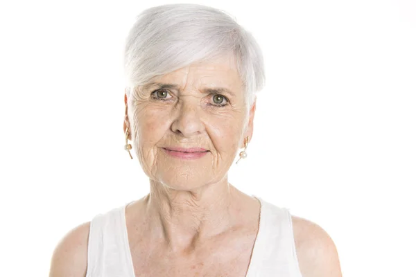 Elderly woman on studio white background — Stock Photo, Image