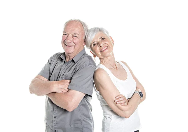 Senior couple posing on studio white background arm cross — Stock Photo, Image