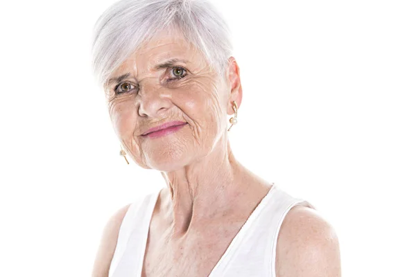 Elderly woman on studio white background — Stock Photo, Image