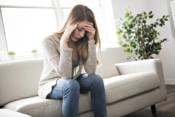 Portrait of woman with sad look on the livingroom — Stock Photo, Image