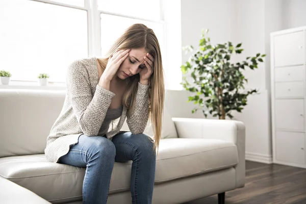 Portrait of woman with sad look on the livingroom — Stock Photo, Image
