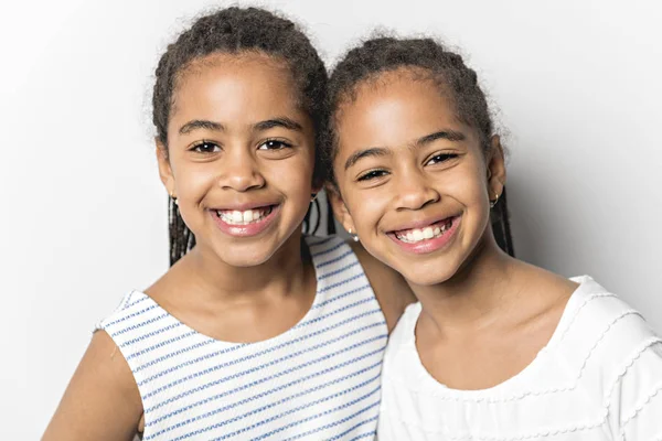 Adorable african twin little girls on studio gray background — Stock Photo, Image