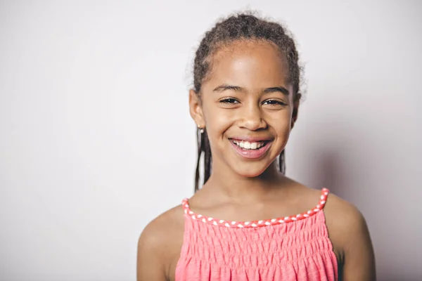 Cute nine years old child with pink dress on studio white background — Stock Photo, Image