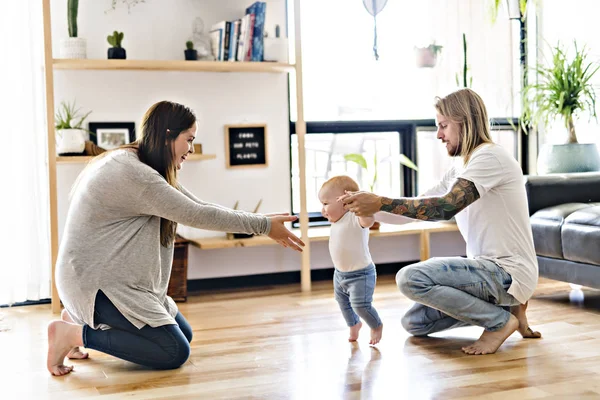 Nice parent help Baby Daughter Take First Steps At Home