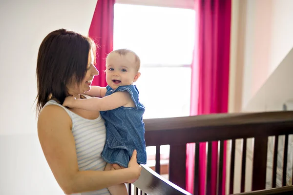 Portrait of a beautiful mother with her 10-month-old baby — Stock Photo, Image