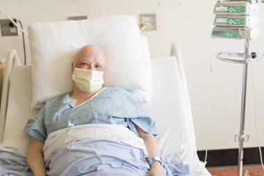 woman in hospital bed suffering from cancer clipart