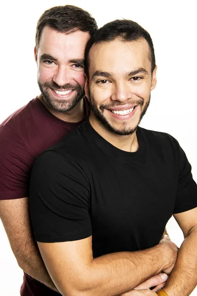 Jóvenes homosexuales pareja gay amor entre sí en un fondo blanco . — Foto de Stock