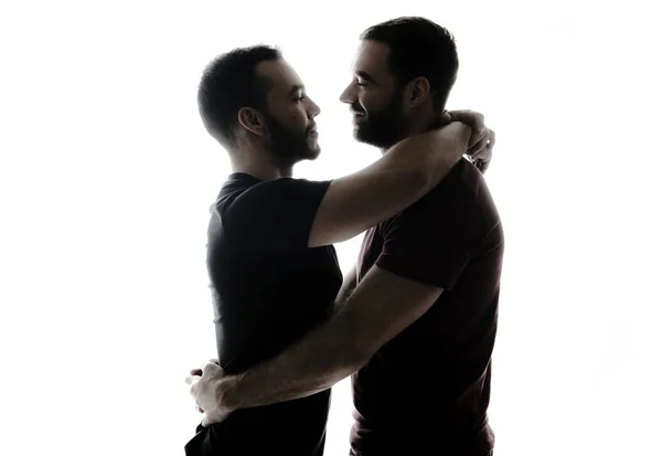 Les jeunes homosexuels couple ombre s'aiment sur un fond blanc . — Photo