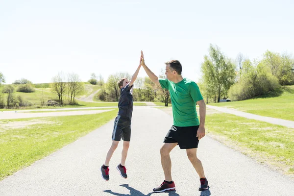 Father with son sport running together outside — Stock Photo, Image