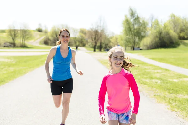 Mother with children girl sport running together outside — Stock Photo, Image