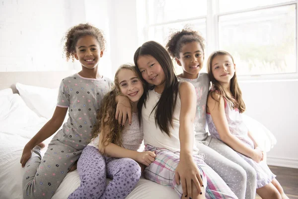 Large group of her friends taking goog time on bed — Stock Photo, Image