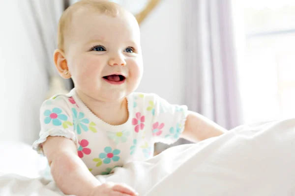 Baby girl in white bedding at home look nice — Stock Photo, Image