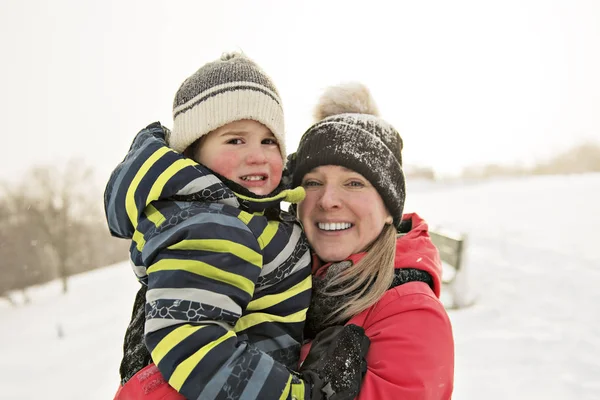 A nice Mother and Son In Snowy Landscape — Stock Photo, Image