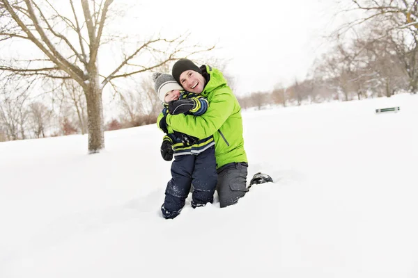 Nice Father And Son In Snowy Landscape — Stock Photo, Image