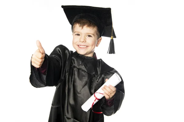 A Young boy 4 years old in graduation dress for the nursery class — Stock Photo, Image