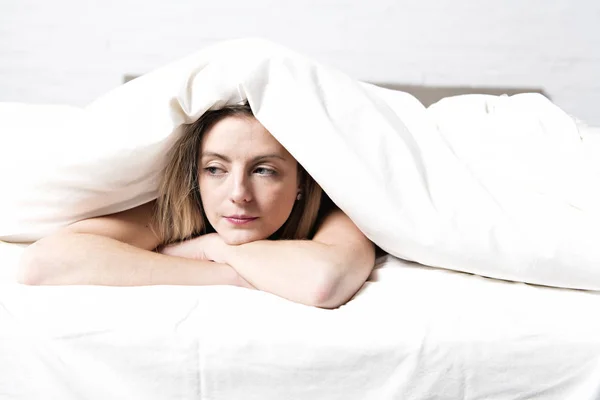 Sad mature female in bed at bedroom — Stock Photo, Image